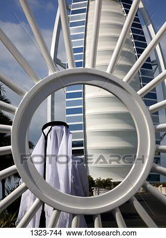 Rear view of a man in front of a hotel, Burj Al Arab Hotel, Dubai, United Arab Emirates View Large Photo Image Picture - Rear view of a man in front of a hotel, Burj Al Arab Hotel, Dubai, United Arab Emirates. Fotosearch