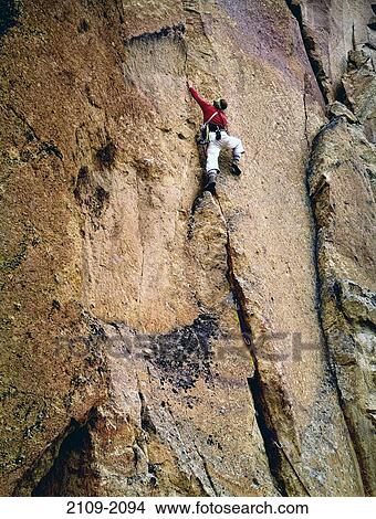 Rear view of a person climbing a rock, Smith Rocks State Park, Oregon, USA View Large Photo Image Picture - Rear view of a person climbing a rock, Smith Rocks State Park, Oregon, USA. Fotosearch