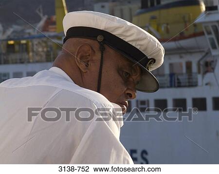Stock Image - Rear view of a sea captain, Sao Vicente Island, Cape Verde. Fotosearch