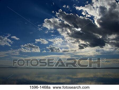 Stock Image - Reflection of clouds in water, Tule Lake National Wildlife Refuge, California, USA. Fotosearch