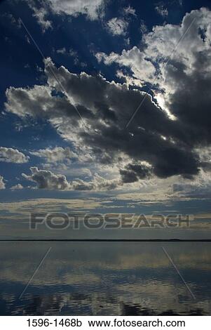 Stock Image - Reflection of clouds in water, Tule Lake National Wildlife Refuge, California, USA. Fotosearch