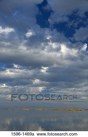 Stock Image - Reflection of clouds in water, Tule Lake National Wildlife Refuge, California, USA. Fotosearch