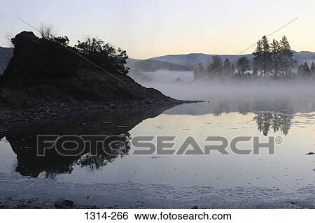 Reflection of trees in water, Flathead River, Montana, USA View Large Photo Image Stock Photograph - Reflection of trees in water, Flathead River, Montana, USA. Fotosearch