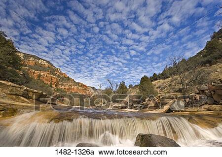 Stock Image - River flowing through a forest, Slide Rock State Park, Sedona, Oak Creek, Arizona, USA. Fotosearch