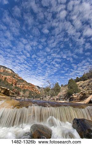 River flowing through a forest, Slide Rock State Park, Sedona, Oak Creek, Arizona, USA View Large Photo Image Stock Image - River flowing through a forest, Slide Rock State Park, Sedona, Oak Creek, Arizona, USA. Fotosearch