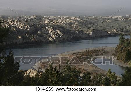 River flowing through mountains, Flathead River, Montana, USA View Large Photo Image Stock Photo - River flowing through mountains, Flathead River, Montana, USA. Fotosearch