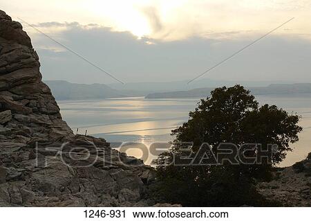 Sea at dusk with a mountain range in the background, Velebit, Croatia View Large Photo Image Stock Image - Sea at dusk with a mountain range in the background, Velebit, Croatia. Fotosearch