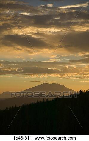 Stock Image - Silhouette of a mountain at dusk, Mt St. Helens, Washington State, USA. Fotosearch