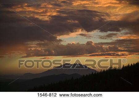 Stock Image - Silhouette of a mountain at dusk, Mt St. Helens, Washington State, USA. Fotosearch