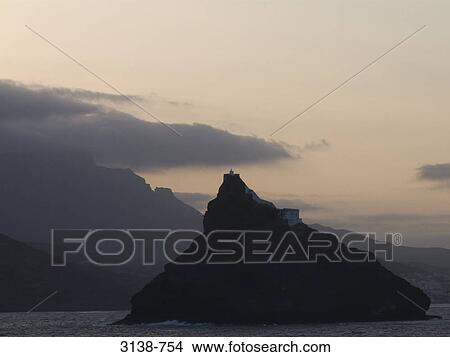 Picture - Silhouette of a mountain in the sea, Sao Vicente Island, Mindelo, Cape Verde. Fotosearch