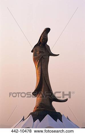 Stock Photo - Statue of Kuan Yin the Goddess of Mercy on a museum, Macao, China. Fotosearch