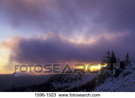 Stock Image - Sunrise over a mountain, Bear Creek Mountain Trail, Goat Rocks Wilderness Area, Wenatchee National Forest, Washington State, USA. Fotosearch
