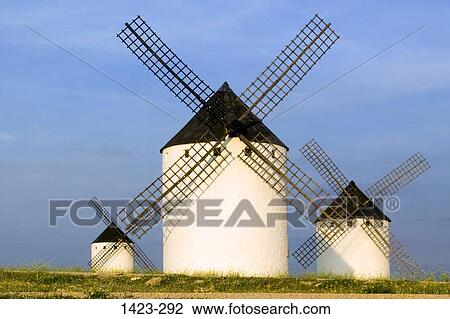 Three traditional windmills in a field, Campo de Criptana, Castilla La Mancha, Spain View Large Photo Image Stock Image - Three traditional windmills in a field, Campo de Criptana, Castilla La Mancha, Spain. Fotosearch