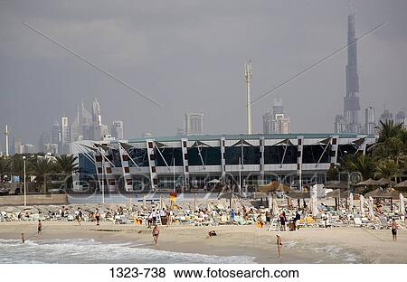 Tourists on the beach, Dubai, United Arab Emirates View Large Photo Image Stock Photo - Tourists on the beach, Dubai, United Arab Emirates. Fotosearch