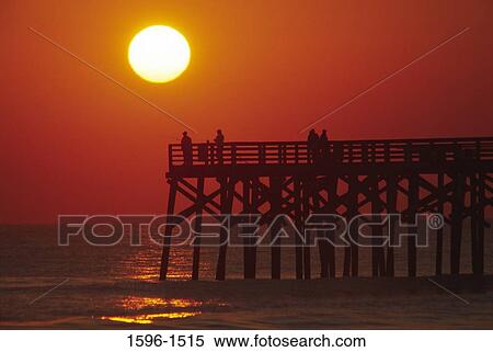 Tourists on the pier at sunrise, Flagler Pier, Flagler County, Florida, USA View Large Photo Image Stock Photography - Tourists on the pier at sunrise, Flagler Pier, Flagler County, Florida, USA. Fotosearch