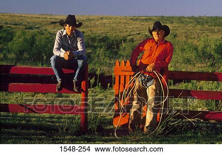 Two cowboys in a ranch with a lasso rope, Texas, USA View Large Photo Image Picture - Two cowboys in a ranch with a lasso rope, Texas, USA. Fotosearch