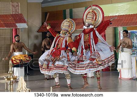 Two Kathakali dancers performing on a stage, Kerala, India View Large Photo Image Stock Image - Two Kathakali dancers performing on a stage, Kerala, India. Fotosearch