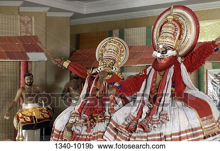 Two Kathakali dancers performing on a stage, Kerala, India View Large Photo Image Stock Image - Two Kathakali dancers performing on a stage, Kerala, India. Fotosearch