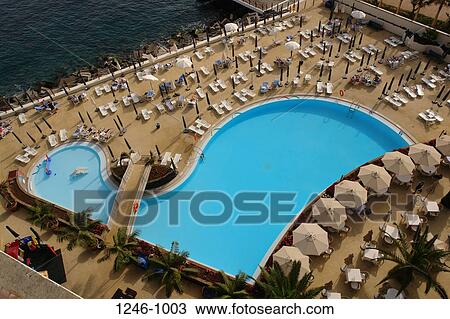 Aerial view of swimming pool in a hotel, Cliff Bay Hotel, Funchal, Madeira, Portugal View Large Photo Image Stock Image - Aerial view of swimming pool in a hotel, Cliff Bay Hotel, Funchal, Madeira, Portugal. Fotosearch