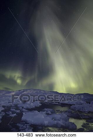 Aurora borealis in the sky at night, Sermilik Fjord, Greenland View Large Photo Image Stock Image - Aurora borealis in the sky at night, Sermilik Fjord, Greenland. Fotosearch