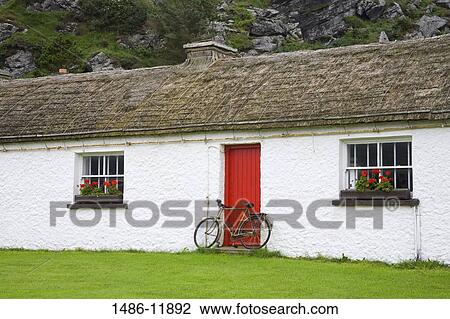 Bicycle leaning against the door of a cottage, Folk Village Museum, Glencolmcille, County Donegal, Ulster Province, Ireland View Large Photo Image Stock Image - Bicycle leaning against the door of a cottage, Folk Village Museum, Glencolmcille, County Donegal, Ulster Province, Ireland. Fotosearch