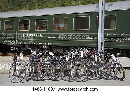 Bicycle parked at a railway station in front of a railroad car, Flam Station, Flam, Aurlandsfjord, Sogn Og Fjordane, Norway View Large Photo Image Stock Photo - Bicycle parked at a railway station in front of a railroad car, Flam Station, Flam, Aurlandsfjord, Sogn Og Fjordane, Norway. Fotosearch