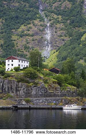 Boat in a fjord with a waterfall in the background, Brekkefossen Waterfall, Flam, Aurlandsfjord, Sogn Og Fjordane, Norway View Large Photo Image Stock Photograph - Boat in a fjord with a waterfall in the background, Brekkefossen Waterfall, Flam, Aurlandsfjord, Sogn Og Fjordane, Norway. Fotosearch