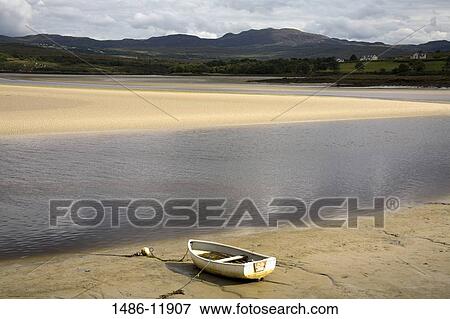 Boat on the beach, Doe Castle, Creeslough, County Donegal, Ulster Province, Ireland View Large Photo Image Stock Photo - Boat on the beach, Doe Castle, Creeslough, County Donegal, Ulster Province, Ireland. Fotosearch