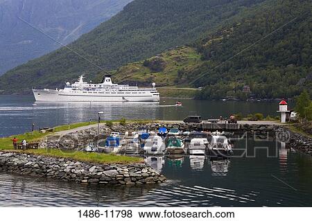 Boats at a harbor with a cruise ship in the background, Flam, Aurlandsfjord, Sogn Og Fjordane, Norway View Large Photo Image Stock Photo - Boats at a harbor with a cruise ship in the background, Flam, Aurlandsfjord, Sogn Og Fjordane, Norway. Fotosearch