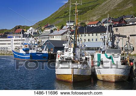 Stock Photograph - Boats moored at a port, Honningsvag Port, Honningsvag, Mageroya Island, Nordkapp, Finnmark County, Norway. Fotosearch