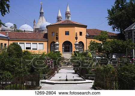 Picture - Botanical garden in front of a building, Orto Botanico di Padova, Padua, Veneto, Italy. Fotosearch