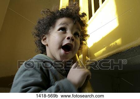 Boy looking upward with a surprise View Large Photo Image Stock Image - Boy looking upward with a surprise. Fotosearch
