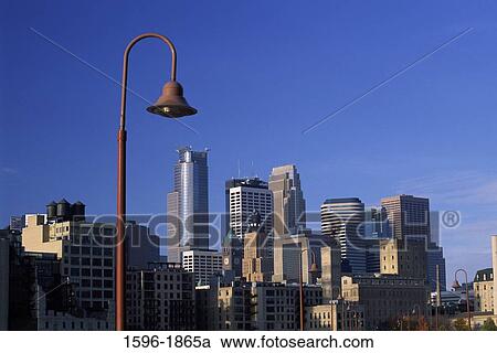 Buildings in a city viewed from a bridge, Stone Arch Bridge, Minneapolis, Hennepin County, Minnesota, USA View Large Photo Image Stock Image - Buildings in a city viewed from a bridge, Stone Arch Bridge, Minneapolis, Hennepin County, Minnesota, USA. Fotosearch