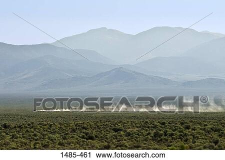 Car passing through a landscape, Nevada, USA View Large Photo Image Stock Image - Car passing through a landscape, Nevada, USA. Fotosearch