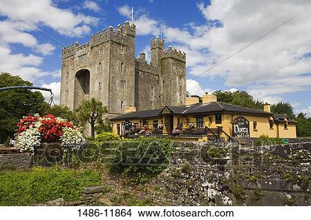 Picture - Castle and a pub, Bunratty Castle, Durty Nelly's Pub, Bunratty, County Clare, Munster Province, Republic of Ireland. Fotosearch