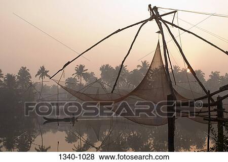 Chinese fishing net in a lagoon, Kerala Backwaters, Cherai, Ernakulam District, Kerala, India View Large Photo Image Stock Photo - Chinese fishing net in a lagoon, Kerala Backwaters, Cherai, Ernakulam District, Kerala, India. Fotosearch