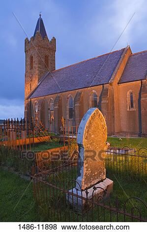 Stock Photo - Church and graves in a cemetery, Church of Ireland, Glencolmcille, County Donegal, Ulster Province, Ireland. Fotosearch