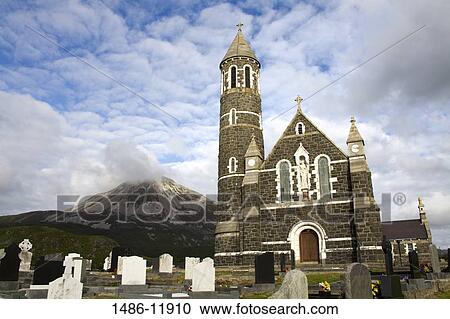 Church and graves in a cemetery with a mountain in the background, Dunlewy Church, Mount Errigal, County Donegal, Ulster Province, Ireland View Large Photo Image Stock Image - Church and graves in a cemetery with a mountain in the background, Dunlewy Church, Mount Errigal, County Donegal, Ulster Province, Ireland. Fotosearch