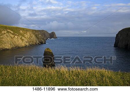 Cliffs on the coast, Malin Beg Bay, Bunglas Cliffs, County Donegal, Ulster Province, Ireland View Large Photo Image Stock Photograph - Cliffs on the coast, Malin Beg Bay, Bunglas Cliffs, County Donegal, Ulster Province, Ireland. Fotosearch