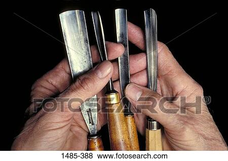 Close-up of a man's hands holding tools View Large Photo Image Stock Photo - Close-up of a man's hands holding tools. Fotosearch
