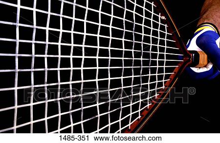 Close-up of a person's hand holding a tennis racket View Large Photo Image Stock Image - Close-up of a person's hand holding a tennis racket. Fotosearch