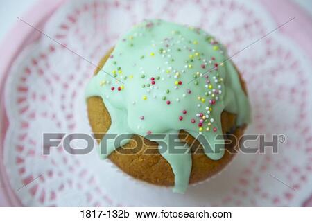 Close-up of an iced muffin on a paper plate View Large Photo Image Stock Image - Close-up of an iced muffin on a paper plate. Fotosearch