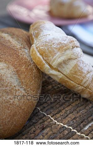 Close-up of breads and pastries on a place mat View Large Photo Image Stock Photo - Close-up of breads and pastries on a place mat. Fotosearch