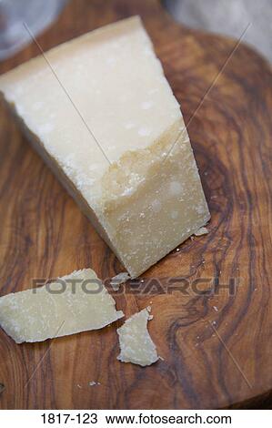 Stock Image - Close-up of Parmesan cheese on a cutting board. Fotosearch
