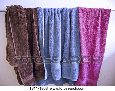 Close-up of three towels hanging on a clothesline View Large Photo Image Stock Image - Close-up of three towels hanging on a clothesline. Fotosearch