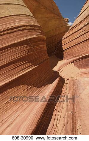 Stock Image - Close-up of wavy pattern on rock formations, Coyote Buttes, Paria Canyon Vermilion Cliffs Wilderness, Arizona, USA. Fotosearch