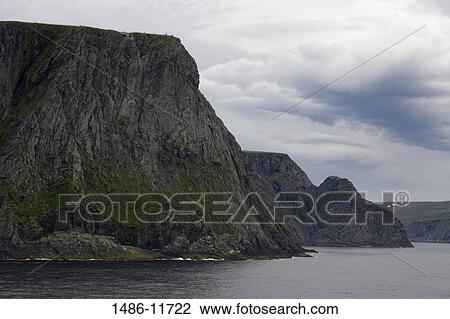 Stock Image - Clouds over mountains, North Cape, Honningsvag Port, Mageroya Island, Finnmark County, Arctic Ocean, Norway. Fotosearch