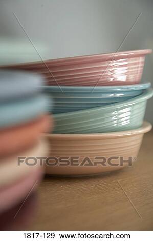 Colorful bowls stacked on a kitchen shelf View Large Photo Image Stock Photo - Colorful bowls stacked on a kitchen shelf. Fotosearch