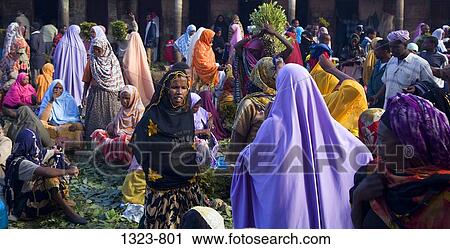 Colorfully dressed women in a market, Harar, Harari, Ethiopia View Large Photo Image Stock Image - Colorfully dressed women in a market, Harar, Harari, Ethiopia. Fotosearch