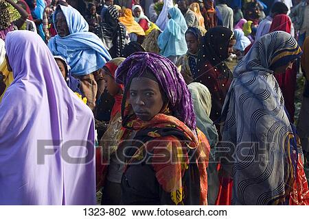 Stock Image - Colorfully dressed women in a market, Harar, Harari, Ethiopia. Fotosearch